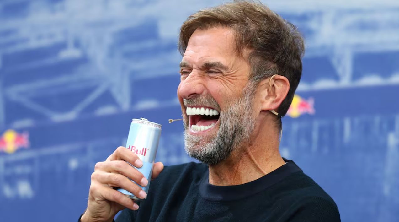 Klopp laughs during an interview.