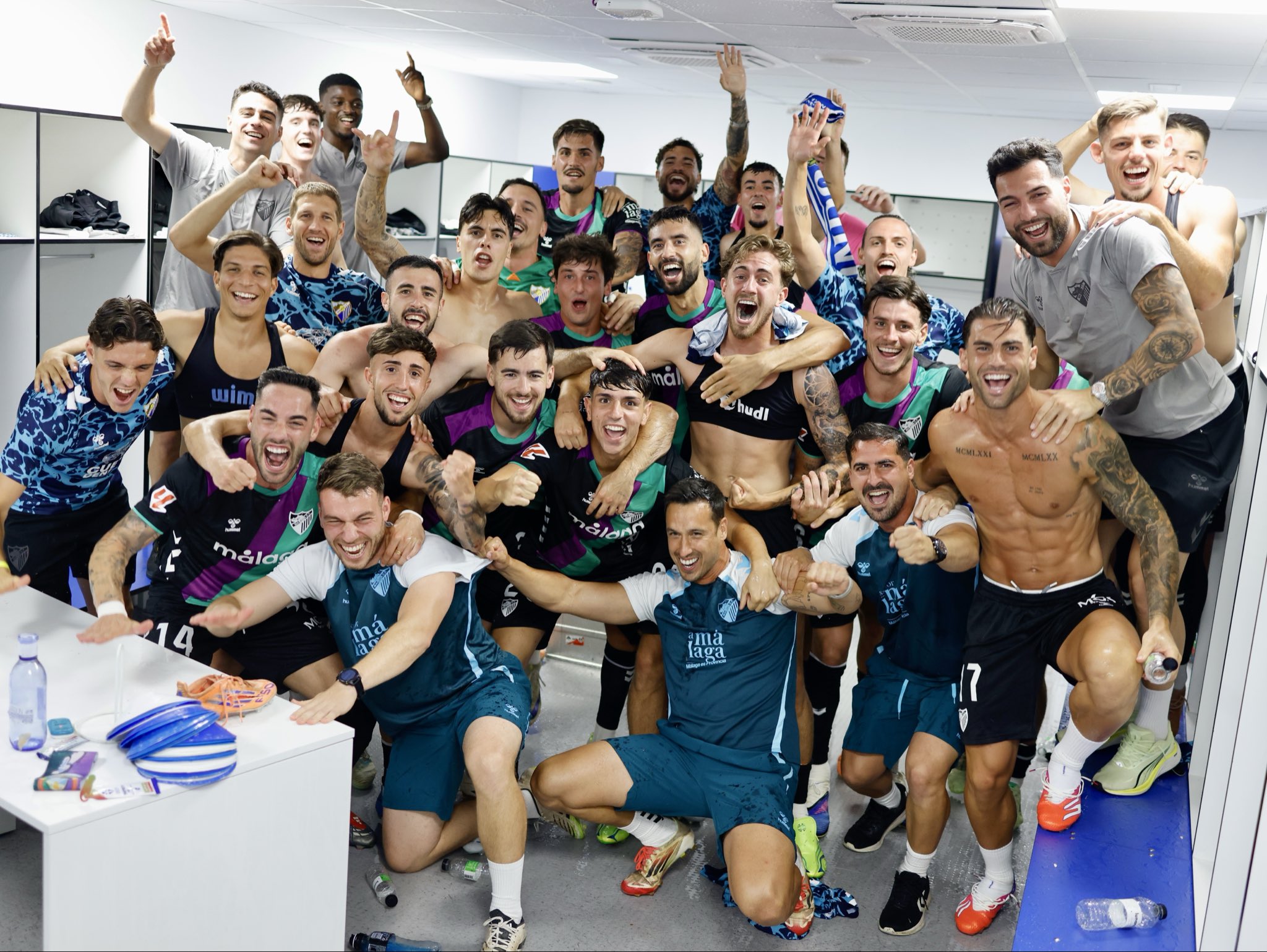 Image via Malaga CF. Malaga celebrate their promotion place.